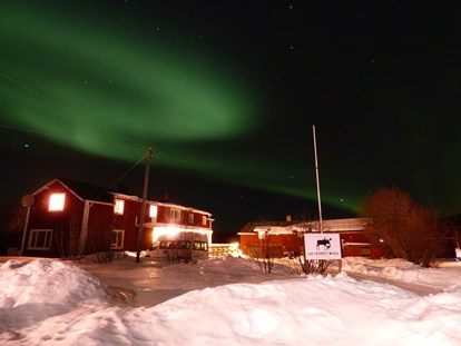 Rollstuhlgerechte Unterkunft - Unterkunftsart: Ferienwohnung - The beautiful Northern Lights over The Friendly Mose - The Friendly Moose Lapland
