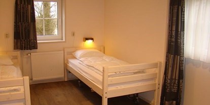 Rollstuhlgerechte Unterkunft - Meer - Schlafzimmer - Behindertengerechte Gruppenunterkunft auf Ameland (Niederlande)